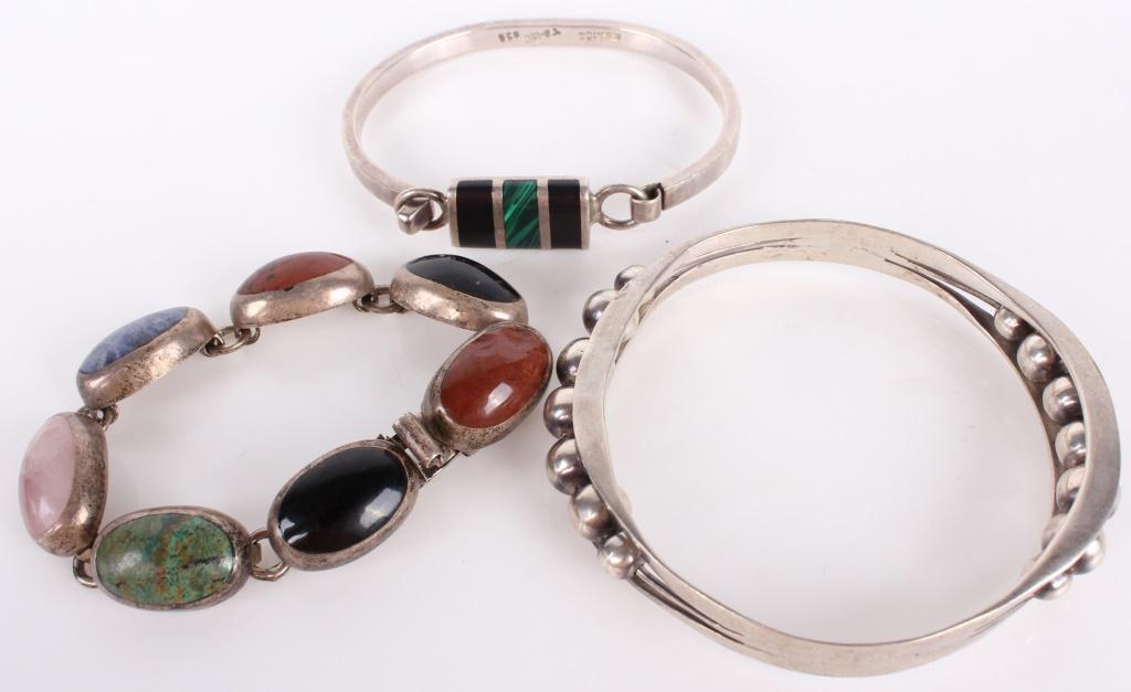 STERLING SILVER TAXCO SOUTHWESTERN BRACELETS (3): 10857STERLING SILVER TAXCO SOUTHWESTERN BRACELETS (3) Sterling silver Taxco Southwestern-style bracelets. Lot of 3 features various semiprecious stones. One featuring bead pattern, one child's bracele