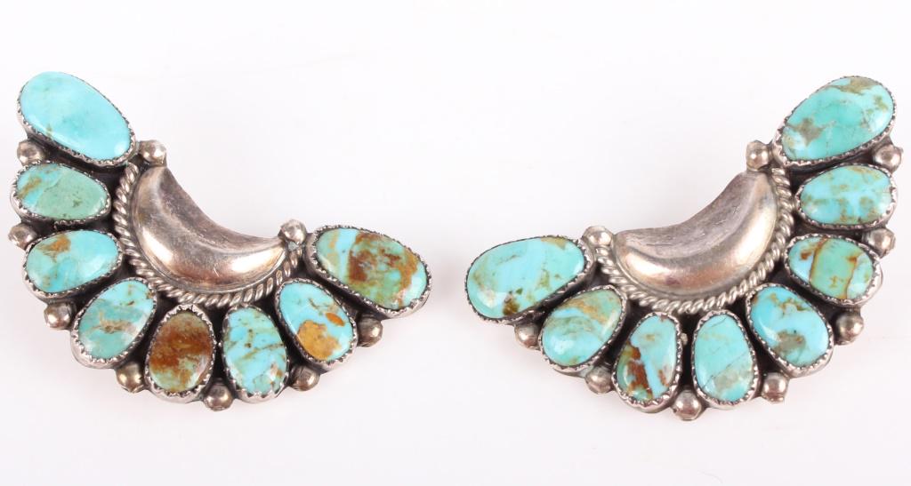 STERLING SILVER DESIGNER NAVAJO ARTIST EARRINGS: 10867STERLING SILVER DESIGNER NAVAJO ARTIST EARRINGS Juliana Williams, Navajo artist, designer earrings. Turquoise stones elegantly set in sterling silver. pin back, stamped "JW Sterling" on reverse.N