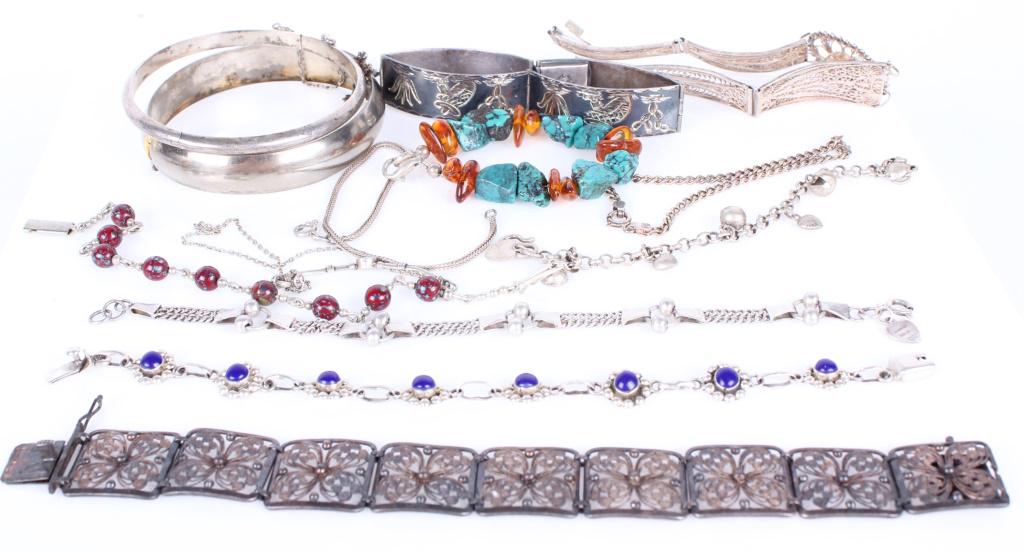 STERLING SILVER VINTAGE LADIES BRACELETS - (12): 10880STERLING SILVER VINTAGE LADIES BRACELETS - (12) Sterling silver vintage ladies bracelets with semiprecious stones and decorative beads. Weight: 124.7 Grams Size: 8"- LargestCondition: Wear commen