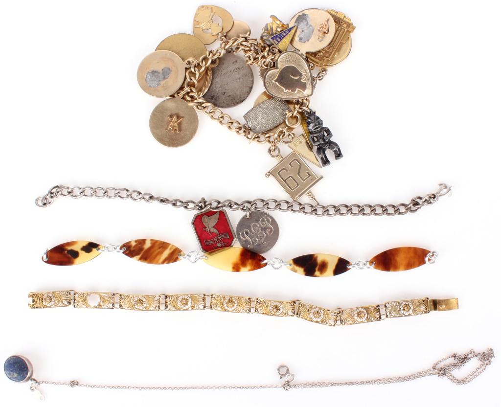 STERLING SILVER CHARM BRACLETS AND NECKLACE: 10881STERLING SILVER CHARM BRACLETS AND NECKLACE Sterling silver bracelets, two charm bracelets, two link bracelets and one necklace with semiprecious stone pendant. Size: 20"- longestCondition: Fine