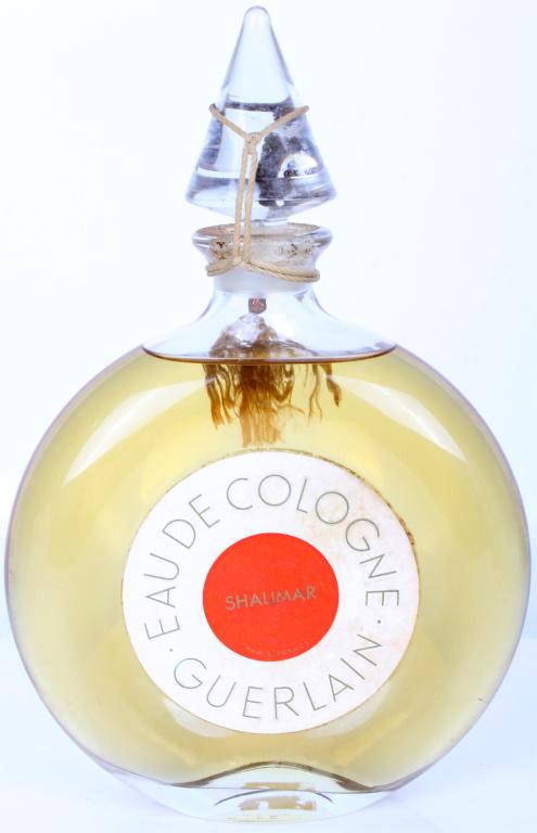 VINTAGE SHALIMAR BY GUERLAIN 16 OZ COLOGNE SEALED: 11040VINTAGE SHALIMAR BY GUERLAIN 16 OZ COLOGNE SEALED Shalimar by Guerlain vintage 16 oz cologne bottle, still sealed. Size: 9.75" Condition: New - Sealed 9.75"