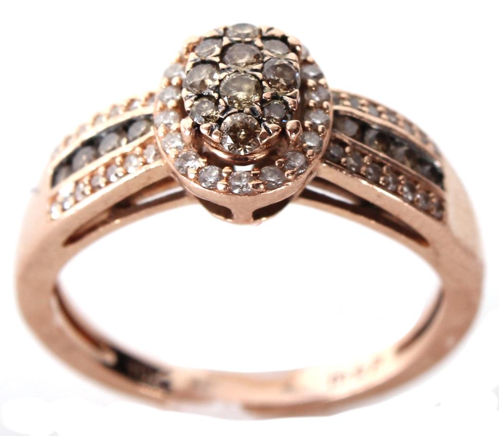 10K YELLOW GOLD CHOCOLATE DIAMOND LADIES RING: 1120410K YELLOW GOLD CHOCOLATE DIAMOND LADIES RING 10k yellow gold chocolate diamond and white diamond ladies ring with approximately fifty .01ct diamonds. Diamond Weight: 3.1 GramsSize: 7.0 Condition
