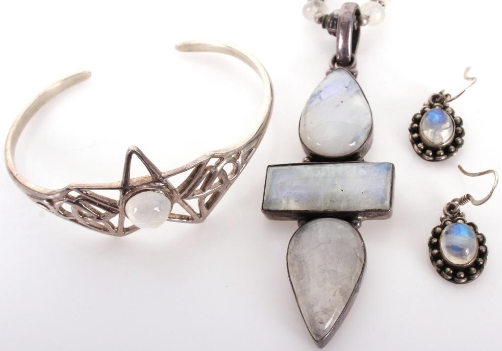 STERLING SILVER & MOONSTONE JEWELRY SET - LOT OF 3: 11333STERLING SILVER & MOONSTONE JEWELRY SET - LOT OF 3 Collection of gorgeous detailed sterling silver and moonstone jewelry pieces. To include a star cuff bracelet witha center moonstone, an elegant