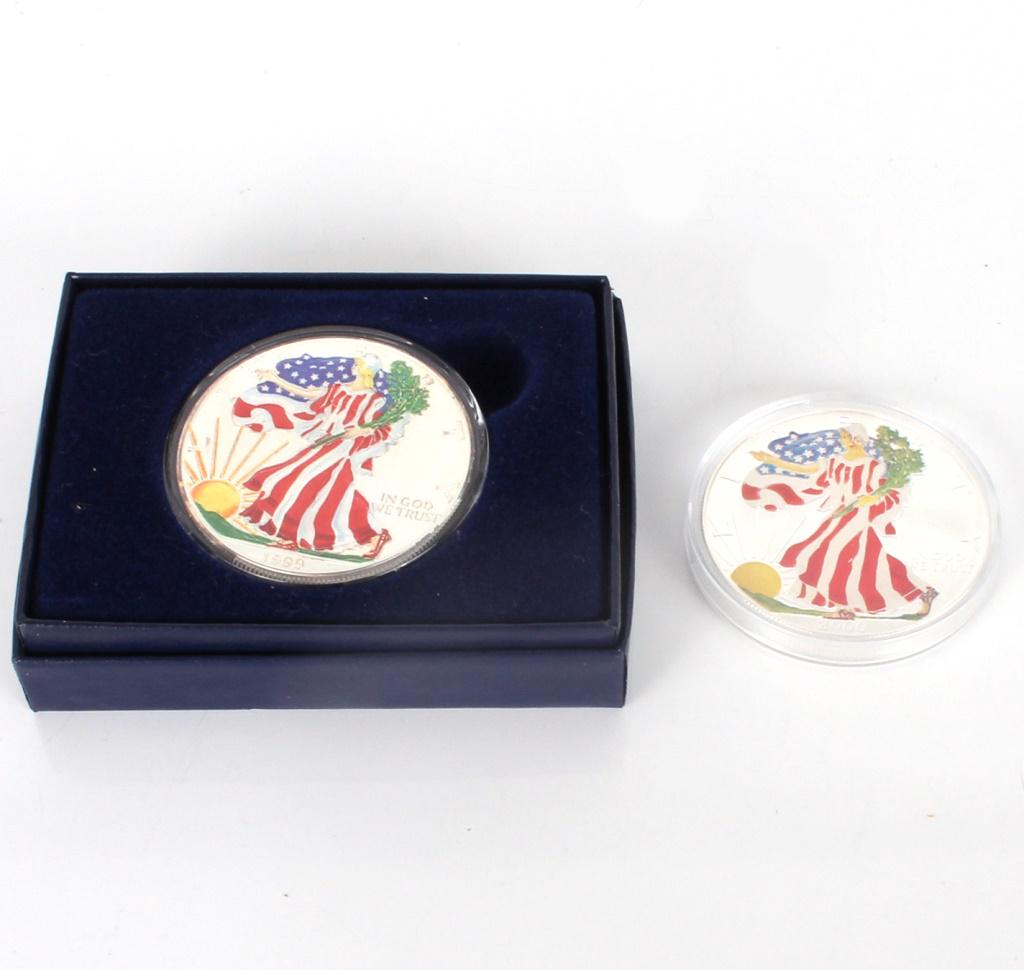 1999 2000 UNCIRCULATED PAINTED SILVER EAGLES - (2): 114281999 2000 UNCIRCULATED PAINTED SILVER EAGLES - (2) 1999 & 2000 uncirculated painted silver eagles. Lot to include one of each year. One contained in box, the other just in its plastic case.Weight