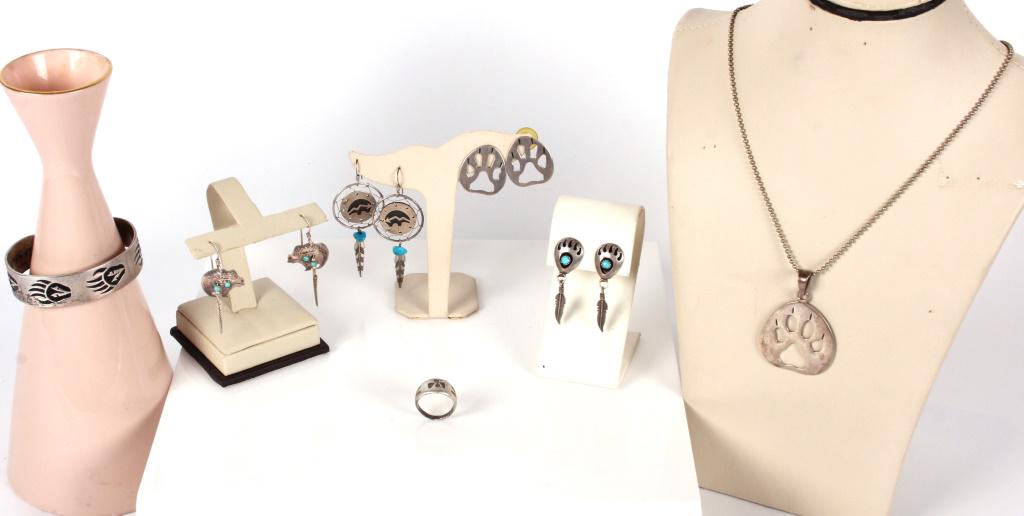 BEAR THEMED NATIVE AMERICAN SILVER JEWELRY - (7): 11514BEAR THEMED NATIVE AMERICAN SILVER JEWELRY - (7) Collection of 7 bear themed vintage Native American sterling silver jewelry pieces. Lot includes 1chain necklace with a bear paw silver pendant, a