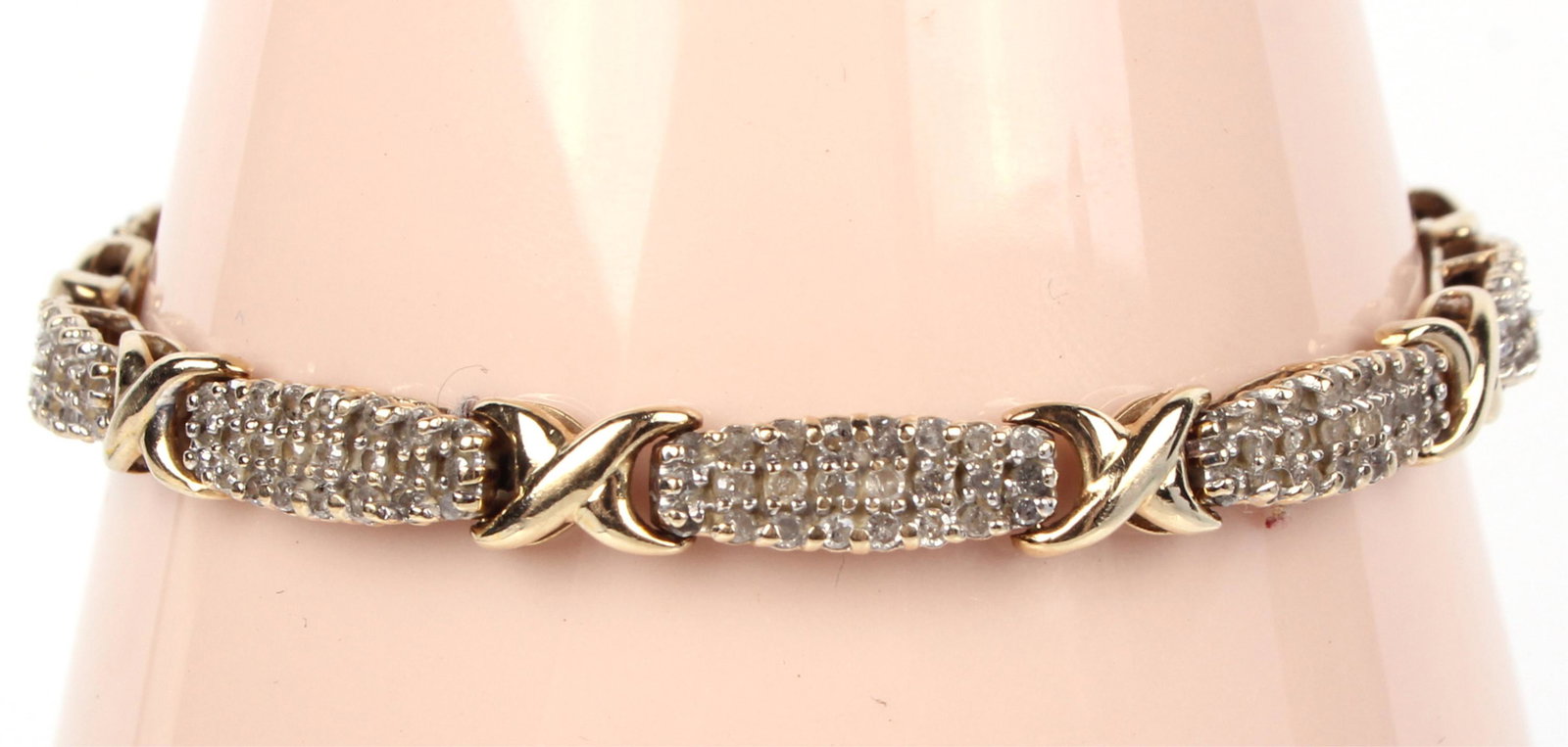 14K YELLOW GOLD & DIAMOND UNISEX BRACELET: 118033 14K YELLOW GOLD & DIAMOND UNISEX BRACELET 14K yellow gold & diamond "XO" unisex bracelet with approximately 2.8 CTW in .01 CT round diamonds. Diamond Weight: 9.3 GramsSize: 7.5" Condition: Fine