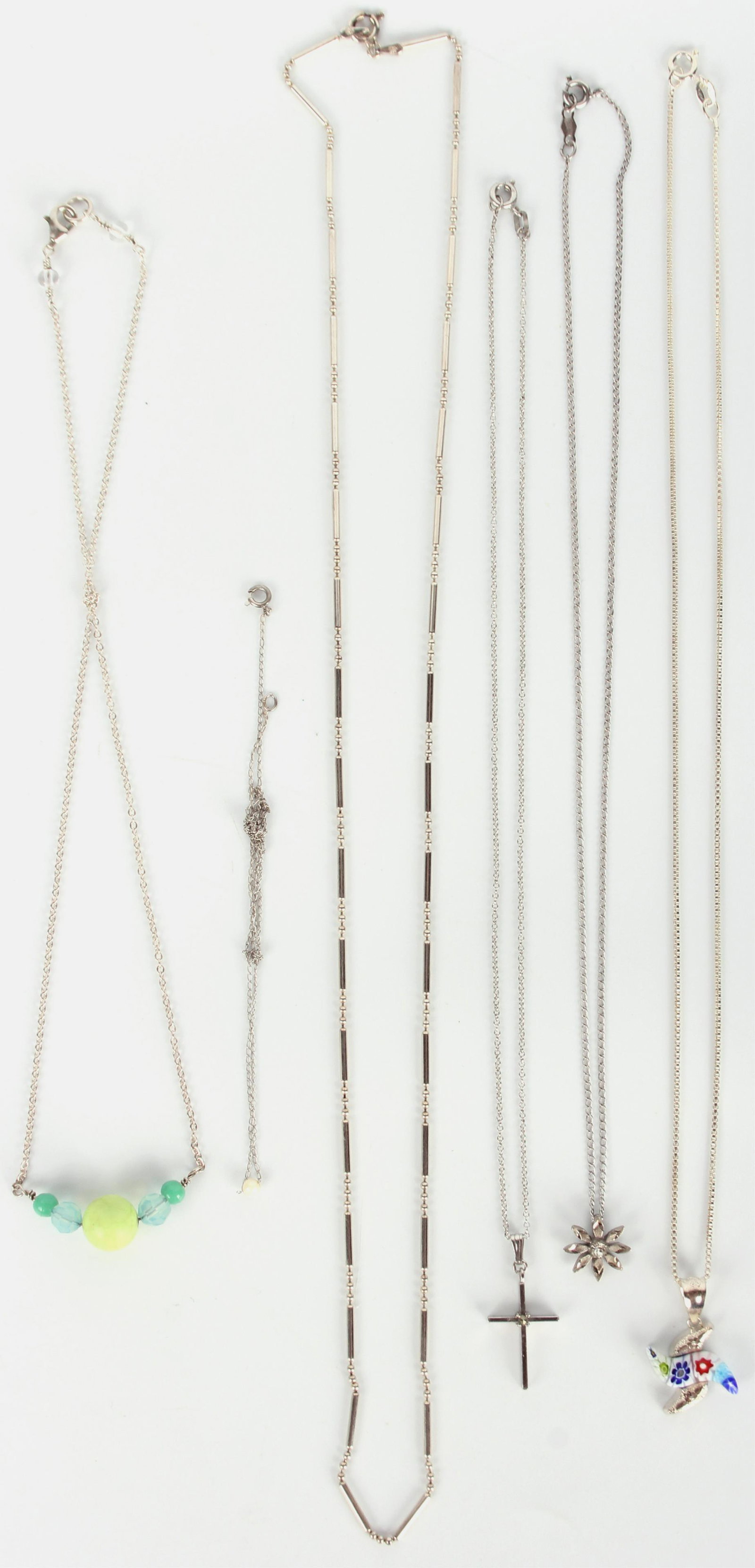 STERLING SILVER NECKLACES - LOT OF 6: 118069 STERLING SILVER NECKLACES - LOT OF 6 Sterling silver necklaces to include one Mille Fiori Venetian glass pendant necklace. Weight: 18.6 Grams Condition: Very fine