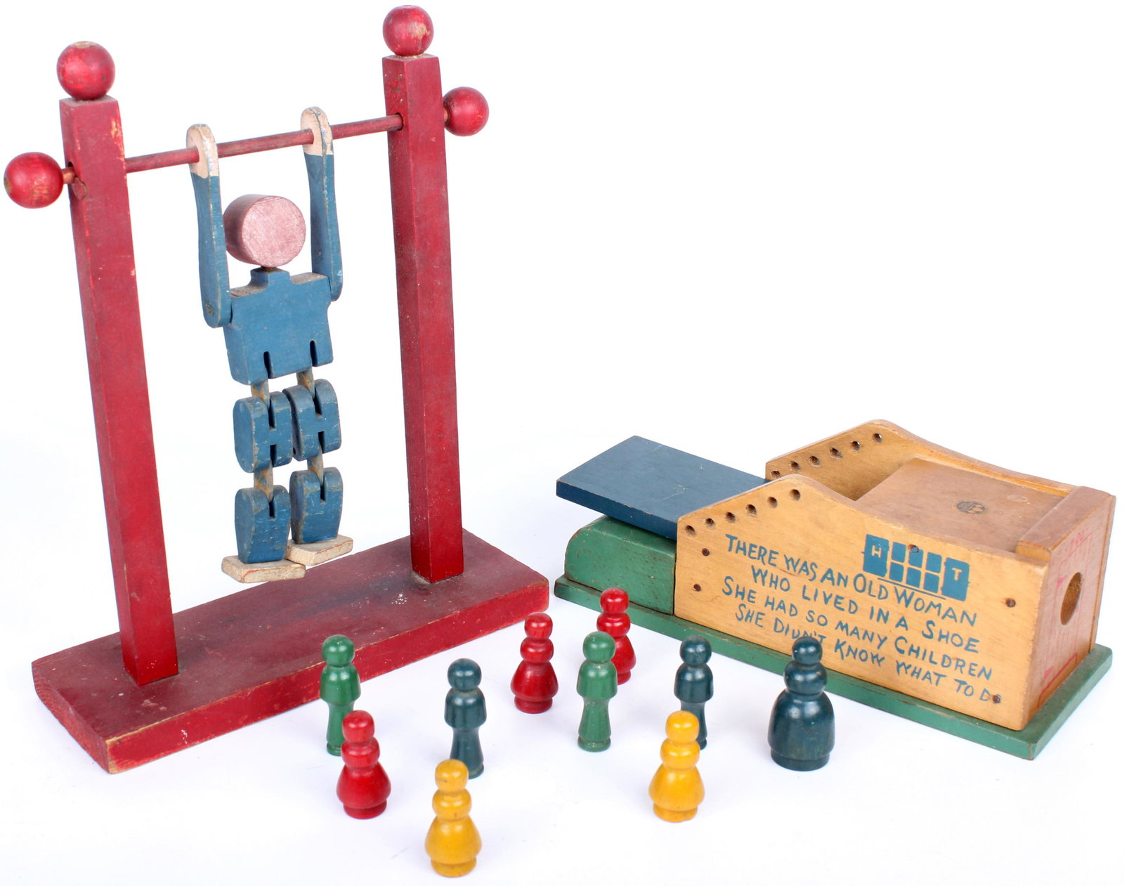 ANTIQUE TIP TOP TOY & HOLGATE NURSERY RHYME TOY: 118237 ANTIQUE TIP TOP TOY & HOLGATE NURSERY RHYME TOY Antique Tip Top toy and Holgate nursery rhyme toy to include a man on a monkey bar toy and an old woman that lived in a shoe toy. Condition: Wear
