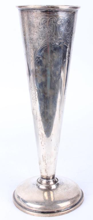 STERLING SILVER CHAMPAGNE TRUMPET FLUTE: STERLING SILVER CHAMPAGNE TRUMPET FLUTE Sterling silver champagne trumpet flute, marked with etched floral designs Weight: 279.9 Grams Size: 10.75" TallCondition: Slight tarnishing