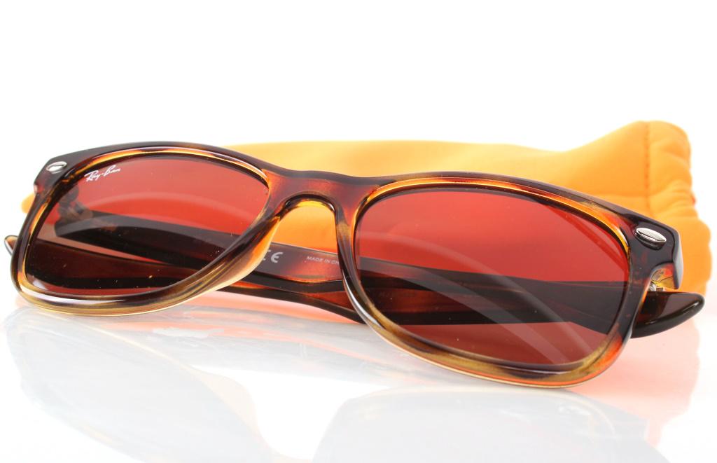 RAY-BAN SUNGLASSES CALICO WITH ORIGINAL BAG: RAY-BAN SUNGLASSES CALICO WITH ORIGINAL BAG Calico Ray-Ban Jr sunglasses with original neon orange bag. Inside reads "RJ9052S 152/73 48 16 130 3N". Condition: Like new