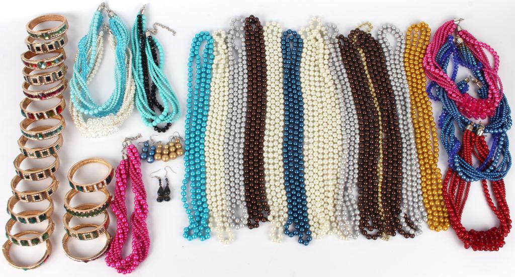 ASSORTED IMPORTED CHINESE LADIES JEWELRY: 128052 ASSORTED IMPORTED CHINESE LADIES JEWELRY Assorted imported Chinese ladies jewelry to include colorful beaded necklaces and bejeweled gold toned bracelets. Size: 56" LargestCondition: Very fine.