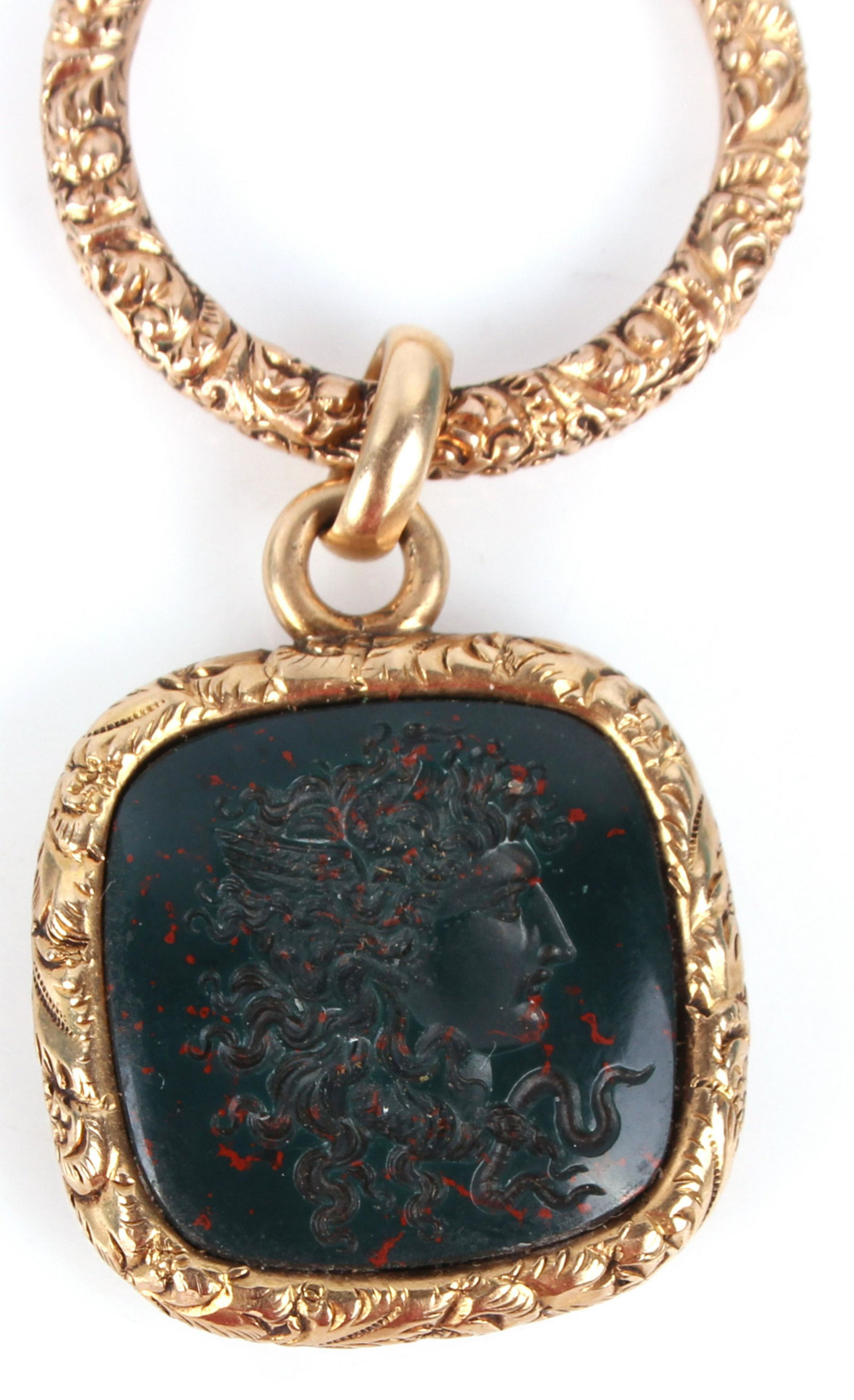 14K YELLOW GOLD BLOODSTONE JASPER PENDANT: 129044 14K YELLOW GOLD BLOODSTONE JASPER PENDANT 14k yellow gold bloodstone jasper pendant Weight: 8.6 Grams Size: 2" length, .75 X .75" gemstone Condition: Very fine