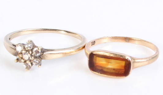 10K YELLOW GOLD LADIES RINGS W/ SPINEL & CZ: 130001 10K YELLOW GOLD LADIES RINGS W/ SPINEL & CZ 10k yellow gold ladies rings to include one CZ flower ring with seven 0.03ct round CZ stones and one ring with one 1.0ct rectangle orange spinel