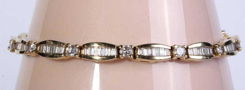 14K YELLOW GOLD 3.30 CTW DIAMOND BRACELET: 130018 14K YELLOW GOLD 3.30 CTW DIAMOND BRACELET ~3.30 CTW diamond 14k yellow gold ladies bracelet with fifteen SI1-VS1 .10ct brilliant round diamonds and ninety SI1-VS1 .02ct baguette inset