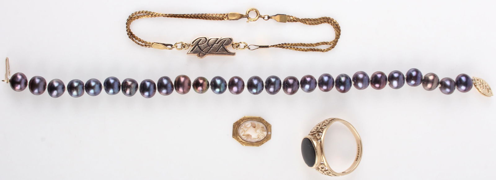 10K YELLOW GOLD ASSORTED LADIES JEWELRY - (4): 131015 10K YELLOW GOLD ASSORTED LADIES JEWELRY - (4) 10k yellow gold ladies jewelry to include one gold men's ring with black onyx, one cultured purple pearl bracelet with gold clasp, one solid gold b