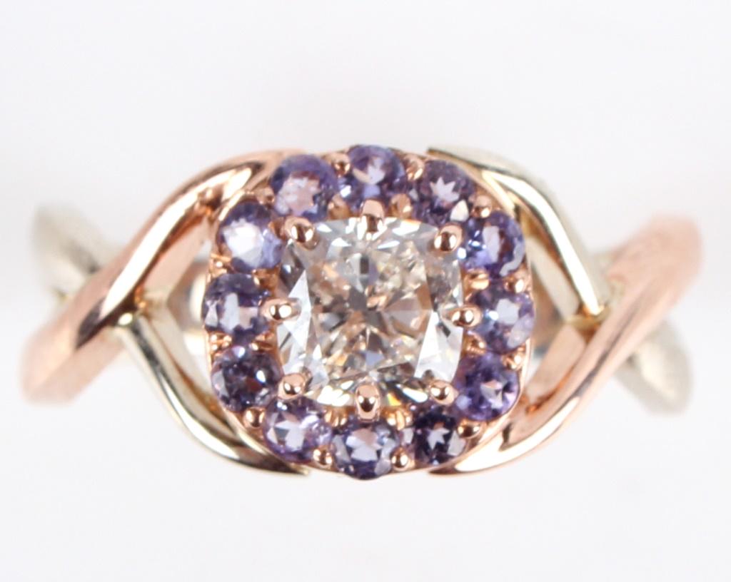 G.I.A. .96CT SI2 DIAMOND & TANZANITE CUSTOM RING: 132011 G.I.A. .96CT SI2 DIAMOND & TANZANITE CUSTOM RING 14K white and rose gold 0.96ct diamond tanzanite ring - A custom 14k white and rose gold overlapping size 7 twist hand style ring set with one 0
