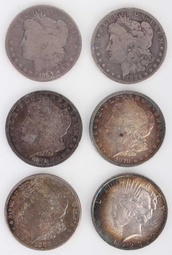 MORGAN SILVER DOLLARS & 1923 PEACE DOLLAR (6): 132104 MORGAN SILVER DOLLARS & 1923 PEACE DOLLAR (6) 90% silver US historic coins to include an 1879 Morgan dollar, a 1878 Morgan, a 1889 Morgan, two 1886 Morgans, and a 1923 Peace dollar (XF). Silver