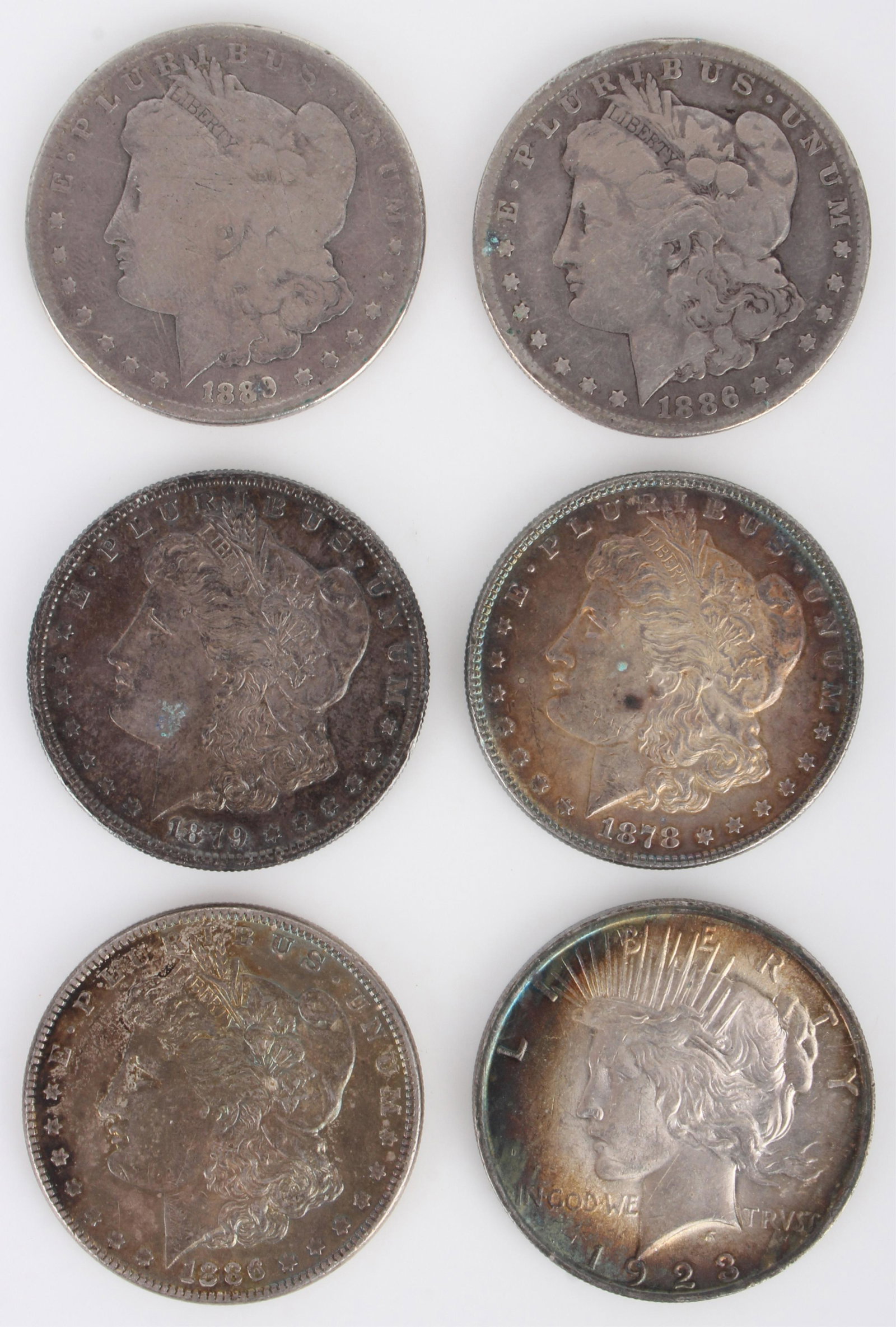 MORGAN SILVER DOLLARS & 1923 PEACE DOLLAR (6): 134094 MORGAN SILVER DOLLARS & 1923 PEACE DOLLAR (6) 90% silver US historic coins to include an 1879 Morgan dollar, a 1878 Morgan, a 1889 Morgan, two 1886 Morgans, and a 1923 Peace dollar (XF). Silver