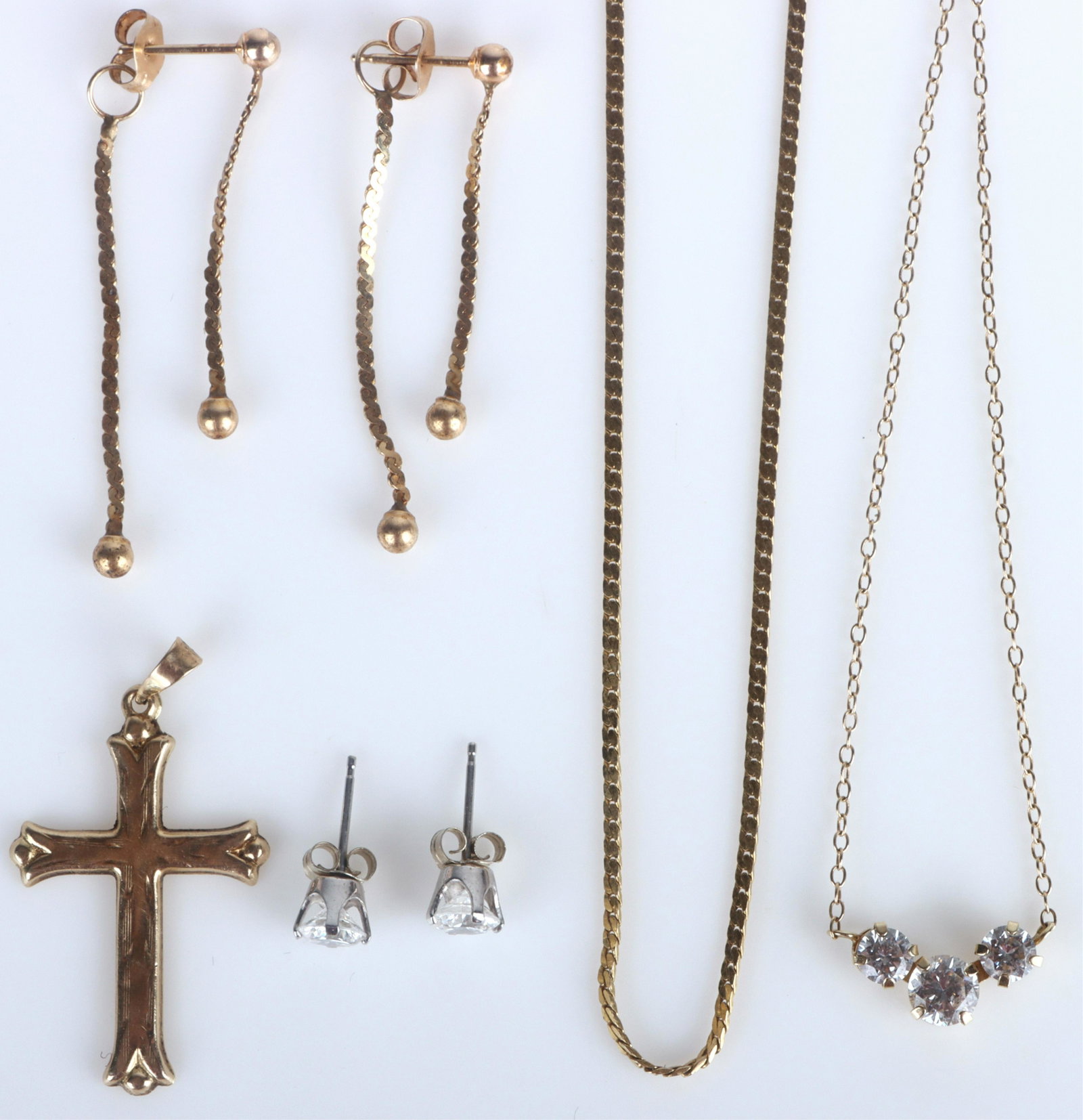 10K YELLOW GOLD LADIES MATCHING SETS - LOT OF 2: 136008 10K YELLOW GOLD LADIES MATCHING SETS - LOT OF 2 10k yellow gold ladies matching sets to include one CZ necklace with matching CZ stud earrings, one matching set with one cross necklace and bead