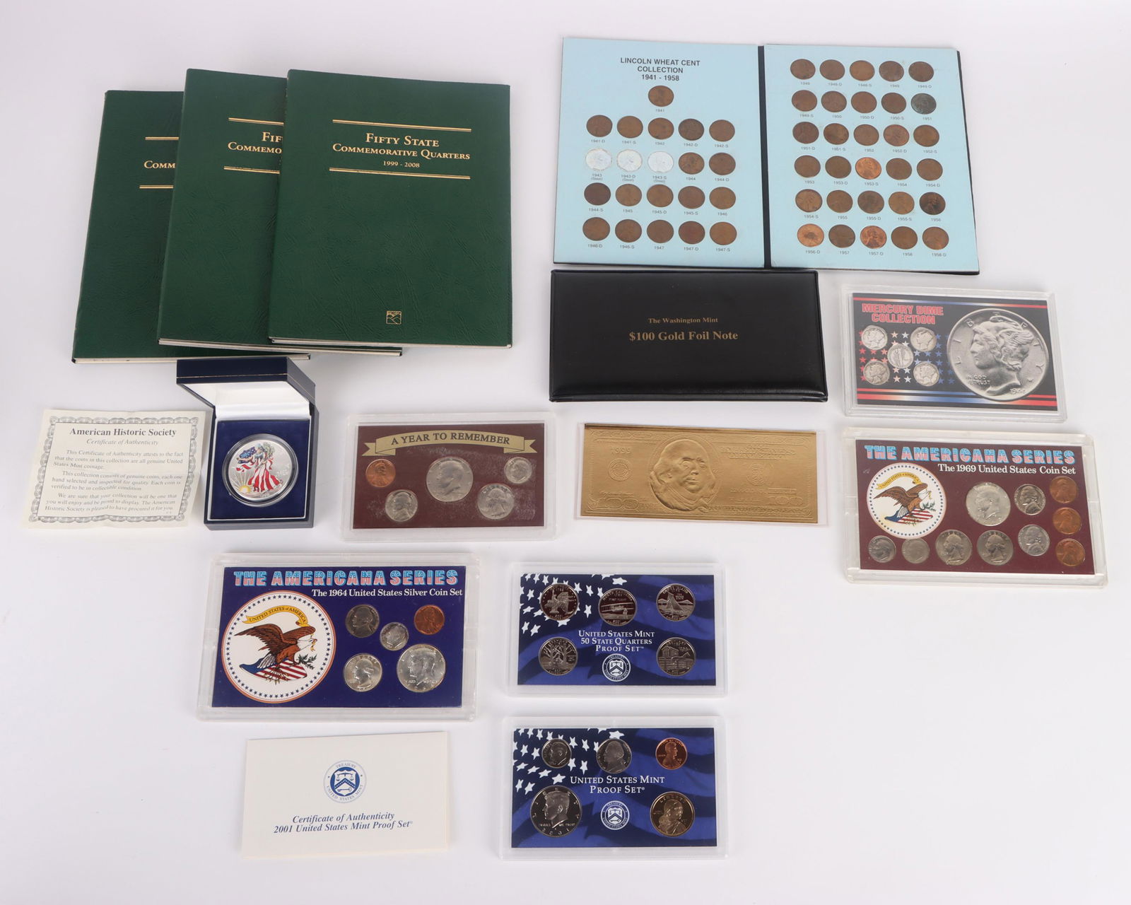 ASSORTED COIN & CURRENCY COLLECTORS LOT: 136079 ASSORTED COIN & CURRENCY COLLECTORS LOT Large coin collectors lot to include 1 colorized Silver Eagle in case, 2001 US Mint proof set, A Year To Remember 1980 Mint Proof Set, Washington Mint 19