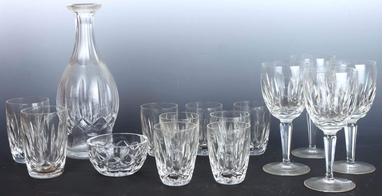 WATERFORD CRYSTAL VASE, CUPS, BOWL & GLASSES: 136133 WATERFORD CRYSTAL VASE, CUPS, BOWL & GLASSES Vintage Waterford crystal lot of 15 to include an 11" vase, a small bowl, 4 wine glasses, 7 short glasses, and 2 tall glasses. Size: AssortedConditi