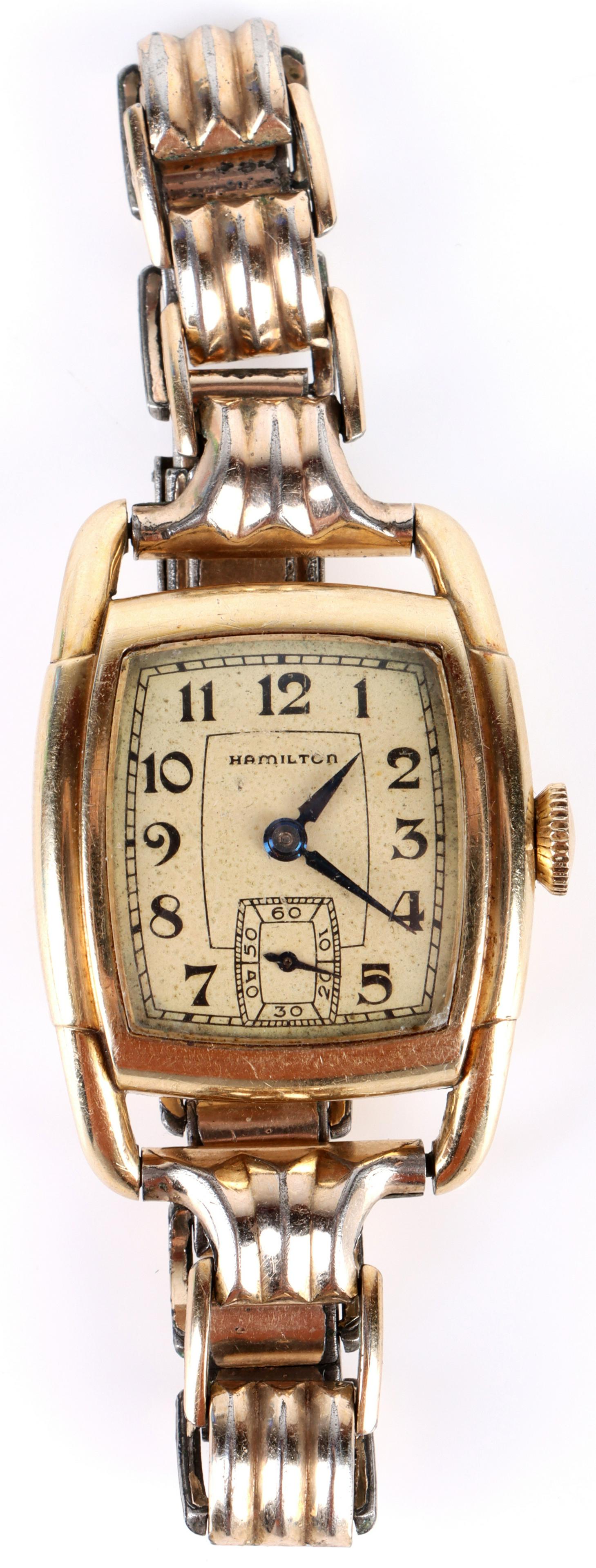 VINTAGE HAMILTON 10K GOLD FILLED LADIES WRISTWATCH: 138189 VINTAGE HAMILTON 10K GOLD FILLED LADIES WRISTWATCH Vintage Hamilton 10k gold filled ladies wrist watch, wind up movement. Gold filled Wristwatch Hamilton Ladies Condition: Age commensurate with
