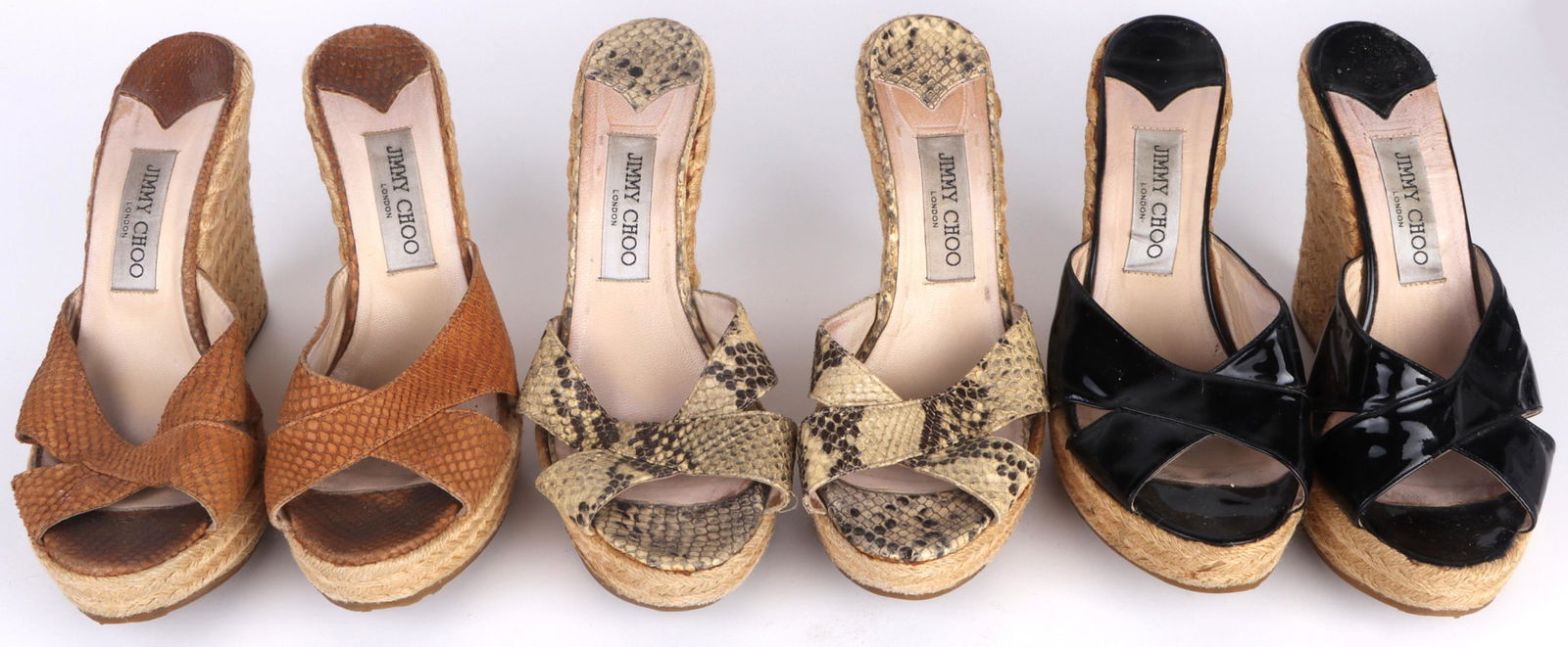 JIMMY CHOO WOMEN'S CROSS STRAP ESPADRILLE WEDGES: 140078 JIMMY CHOO WOMEN'S CROSS STRAP ESPADRILLE WEDGES Jimmy Choo women's cross strap espadrille wedge sandals to include black patent leather, multicolor snake skin pattern, and one brown snake skin