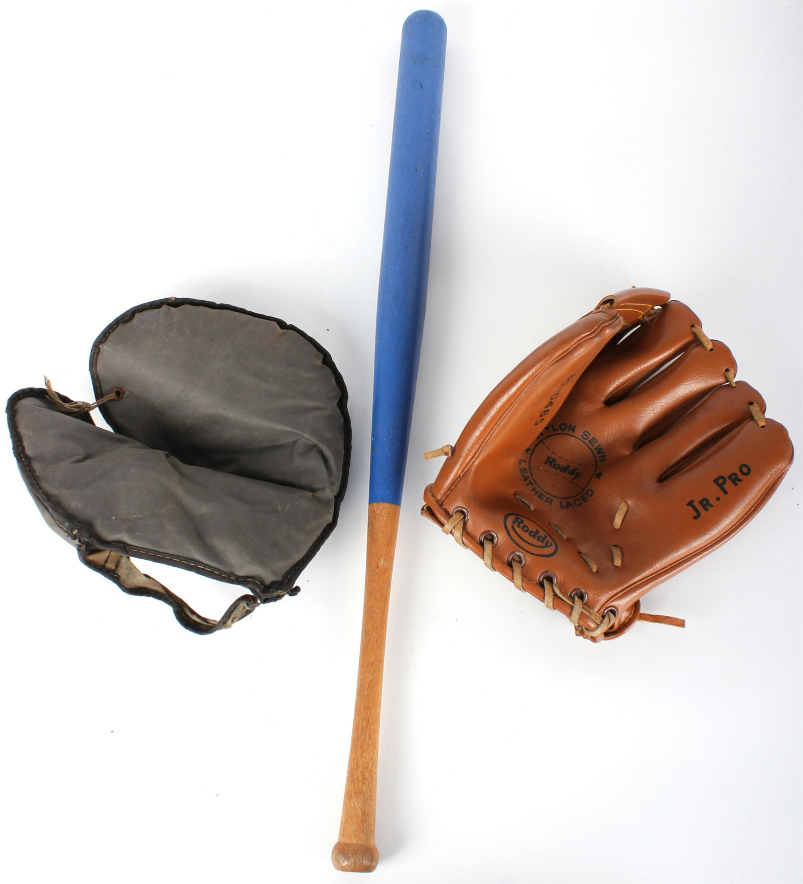 20TH CENTURY BASEBALL MEMORABILIA - LOT OF 3: 145210 20TH CENTURY BASEBALL MEMORABILIA - LOT OF 3 20th century baseball memorabilia to include a Roddy Jr. Pro baseball mitt, a baseball glove, and a baseball bat. Condition: Lightly worn. Baseball