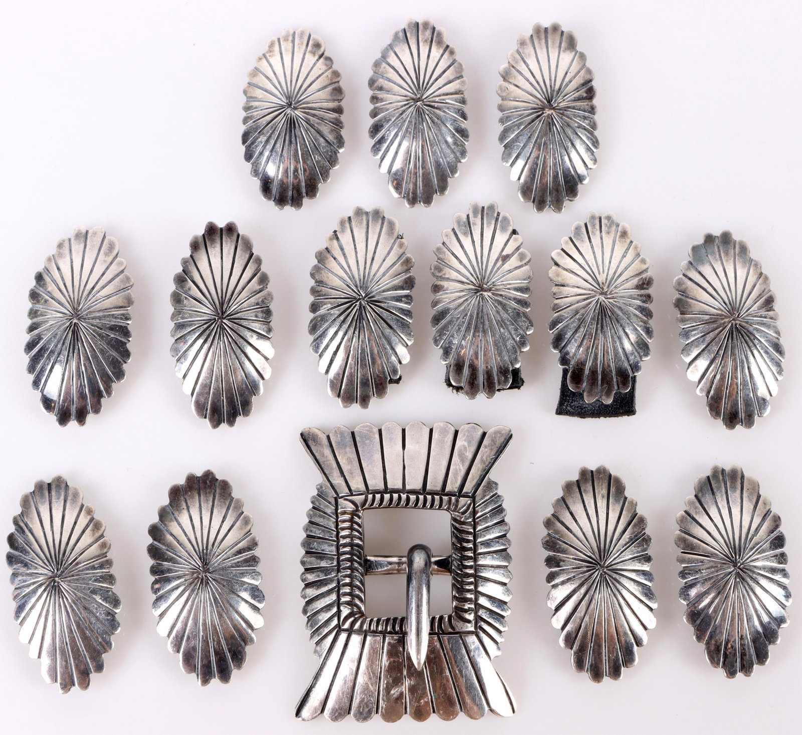 STERLING SILVER NEW MEXICO NECKLACE PIECES: 146114 STERLING SILVER NEW MEXICO NECKLACE PIECES Sterling silver antique New Mexico necklace pieces to include one center pendant and twelve other necklace pieces. Weight: 106.7 GramsSize: 2.0" Large