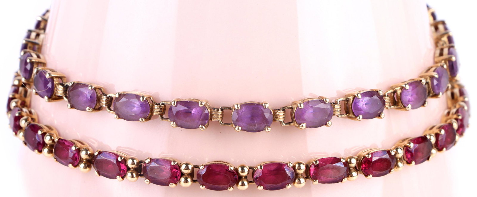 10K YELLOW GOLD AMETHYST LADIES TENNIS BRACELETS: 148039 10K YELLOW GOLD AMETHYST LADIES TENNIS BRACELETS 10k yellow gold amethyst ladies tennis bracelets lot of two with 5.8mm to 6.0mm oval amethysts. Stone Type: AmethystWeight: 15.2 Grams Size: 8" 