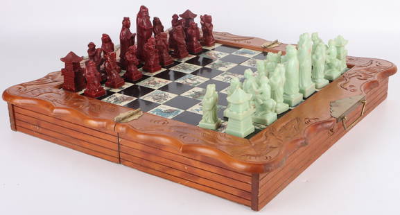 VINTAGE JAPANESE ENGRAVED FOLDABLE CHESS SET: 151207 VINTAGE JAPANESE ENGRAVED FOLDABLE CHESS SET Vintage Japanese foldable Complete chess set. Hand carved resin pieces. Wood engraved. Size: 18.5" x 18.5" Condition: Wear Commensurate with age. Wo