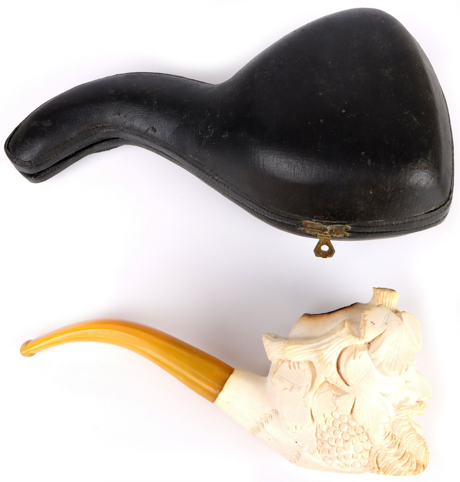 VINTAGE MEERSCHAUM CARVED PIPE & BAKELITE STEM: 154150 VINTAGE MEERSCHAUM CARVED PIPE & BAKELITE STEM Vintage Meerschaum Carved Pipe with yellow Bakelite Stem, bowl carved with image of Dionysus, God Of Wine. Size: 7"Condition: Wear Commensurate wi