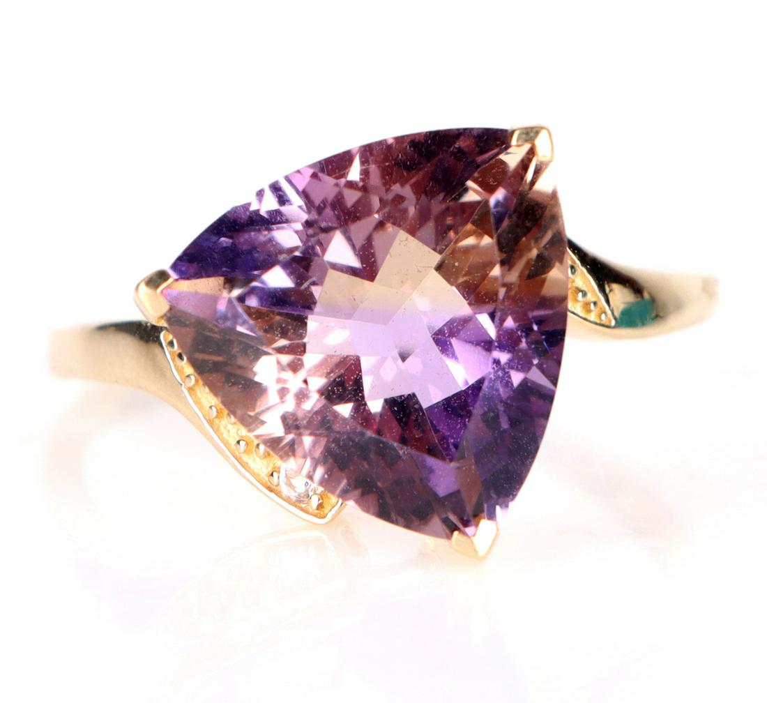 JACQUE CHRISTIE 10K YELLOW GOLD AMETRINE RING: 158028 JACQUE CHRISTIE 10K YELLOW GOLD AMETRINE RING Jacque Christie 10K yellow gold Ametrine ring to include one limited edition Anahi Ametrine and white topaz ring, made with 10K yellow gold.Stone T