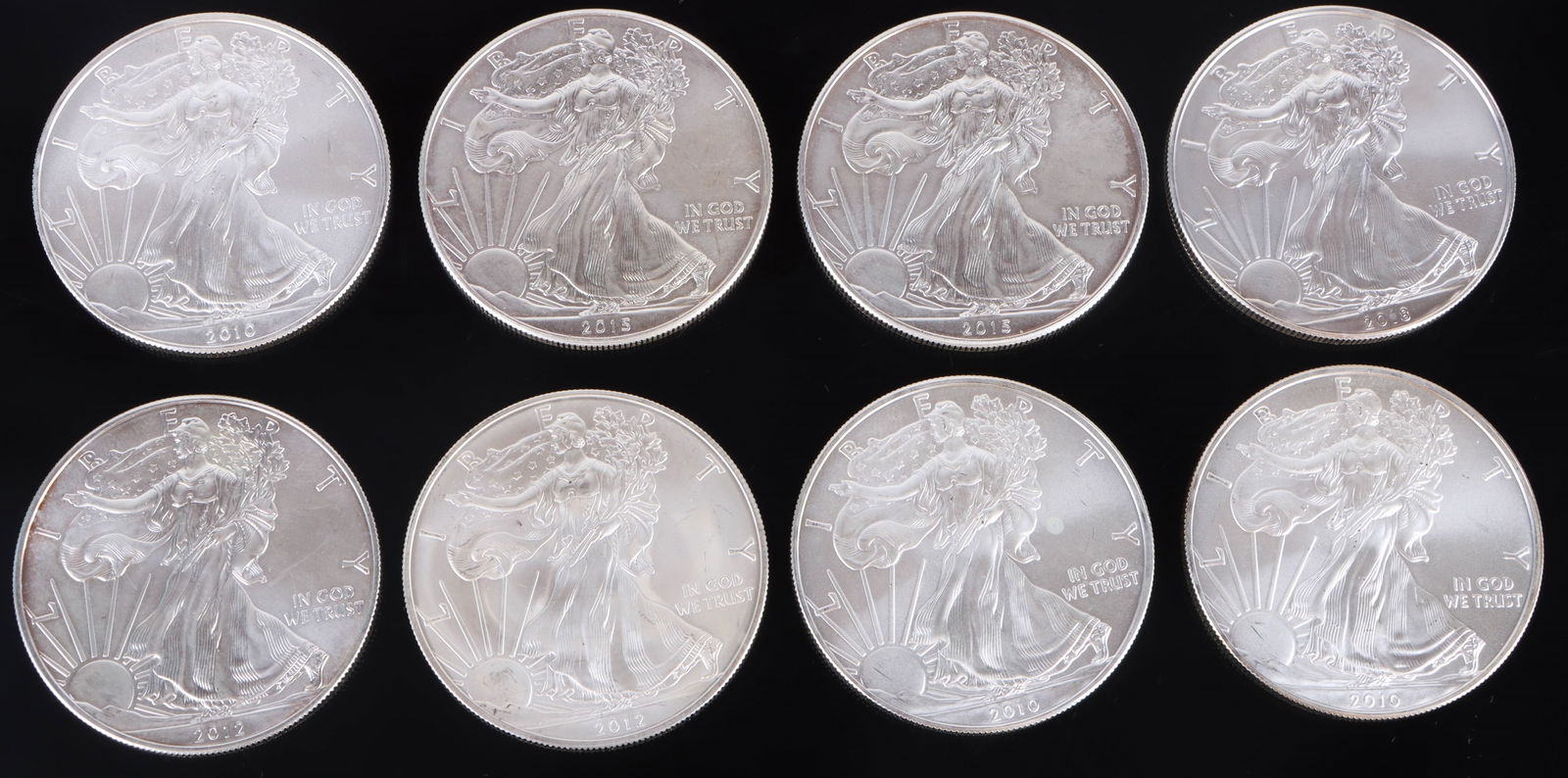 .999 1OZ FINE SILVER MINT LIBERTY DOLLARS - (8): 167201 .999 1OZ FINE SILVER MINT LIBERTY DOLLARS - (8) .999 1oz fine silver eagles liberty dollars to include two 2015, one 2018, two 2012, and thee 2013. Dollars are in uncirculated mint condition.We