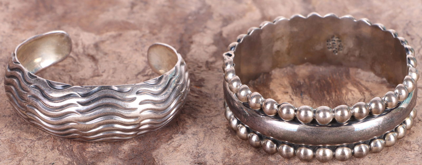 TAXCO MEXICO STERLING SILVER LADIES CUFF BRACELETS: 168214 TAXCO MEXICO STERLING SILVER LADIES CUFF BRACELETS Taxco Mexico sterling silver ladies cuff bracelets. Weight: 83.9 Grams Size: 7.0" LargestCondition: Very fine.