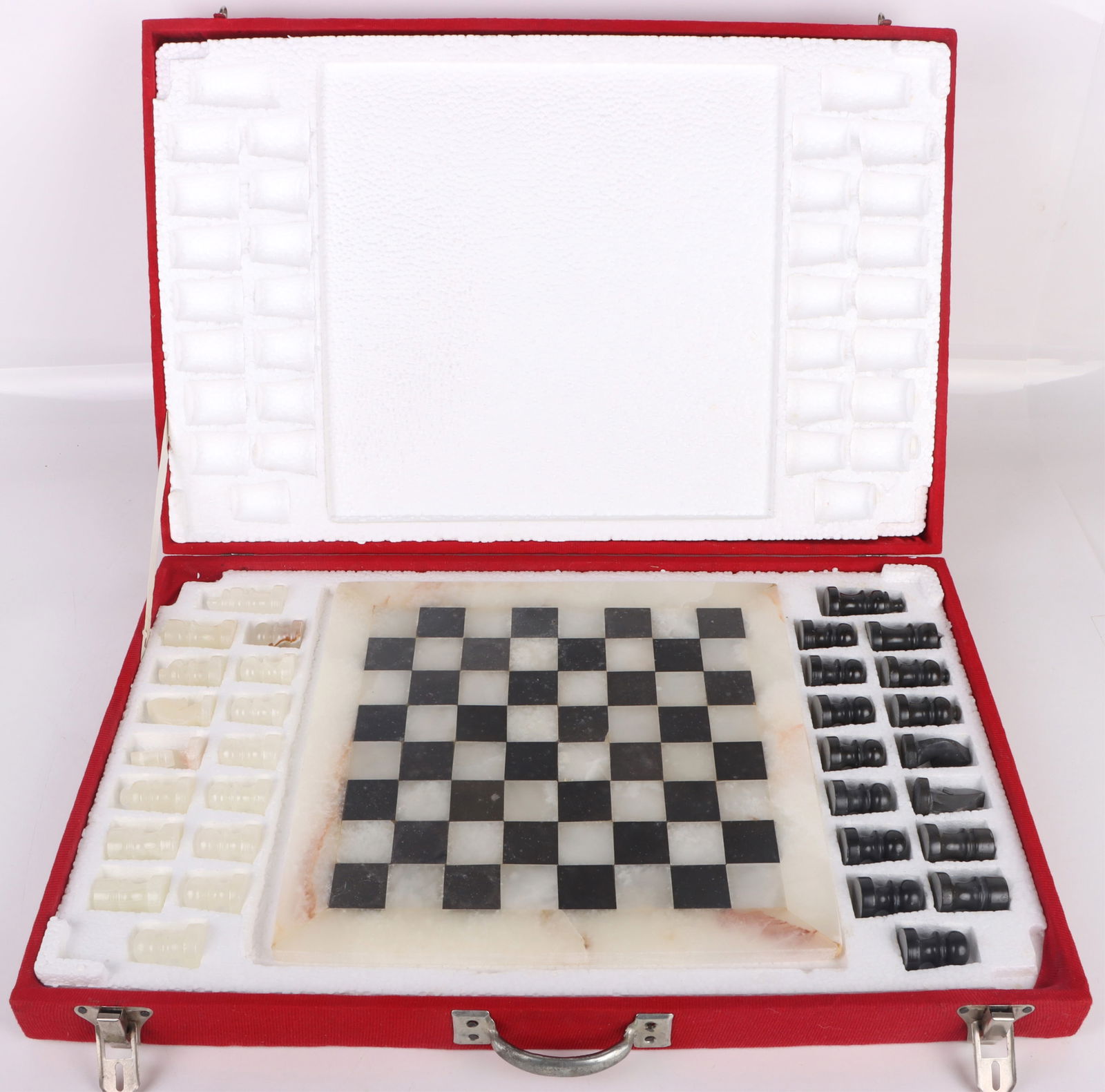 VINTAGE HAND CARVED ONYX & STONE CHESS SET: 170292 VINTAGE HAND CARVED ONYX & STONE CHESS SET Vintage Original hand carved Onyx Marble Stone chess board and pieces. Board is 12 X 12". King is 2 1/8" tall. Board and pieces come in box.Size: 14.5