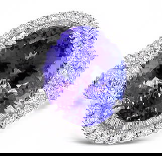 8.95 TANZANITE & 1.96TW DIAMOND 18K GOLD RING: 171029 8.95 TANZANITE & 1.96TW DIAMOND 18K GOLD RING One electronically tested 18KT white gold ladies cast ranzanite and diamond ring. The featured tanzanite is set within a tiered diamond bezel, supp