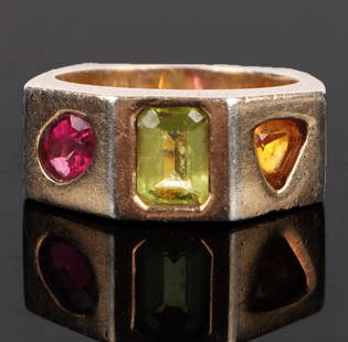 14K PERIDOT, GARNET, ORANGE SAPPHIRE UNISEX RING: 172064 14K PERIDOT, GARNET, ORANGE SAPPHIRE UNISEX RING 14K yellow gold peridot, garnet, orange sapphire unisex ring. Stone Type: Garnet Weight: 6.1 GramsSize: 3.0 US Condition: Very fine