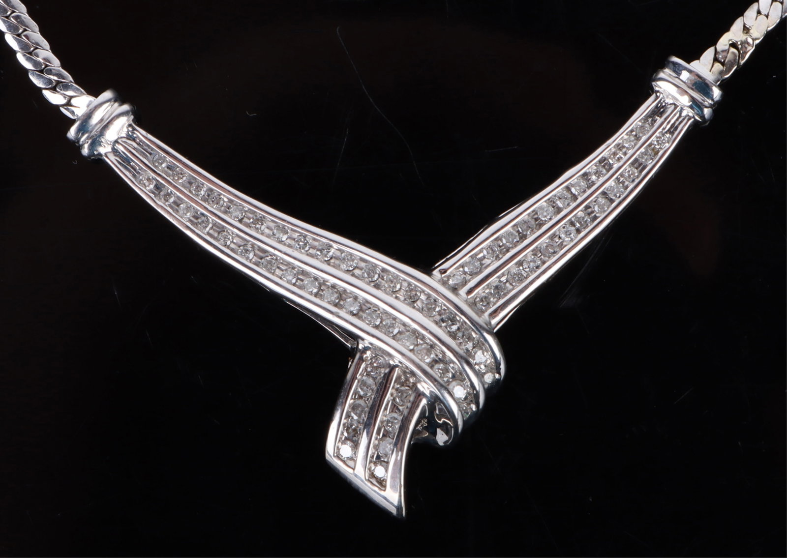 ~1.00CTW DIAMOND 10K WHITE GOLD LADIES NECKALCE: 176109 ~1.00CTW DIAMOND 10K WHITE GOLD LADIES NECKALCE ~1.00CTW diamond 10k white gold ladies necklace with sixty-five 0.01-0.02ct round diamonds. Stone Type: DiamondWeight: 7.3 Grams Size: 16" Length
