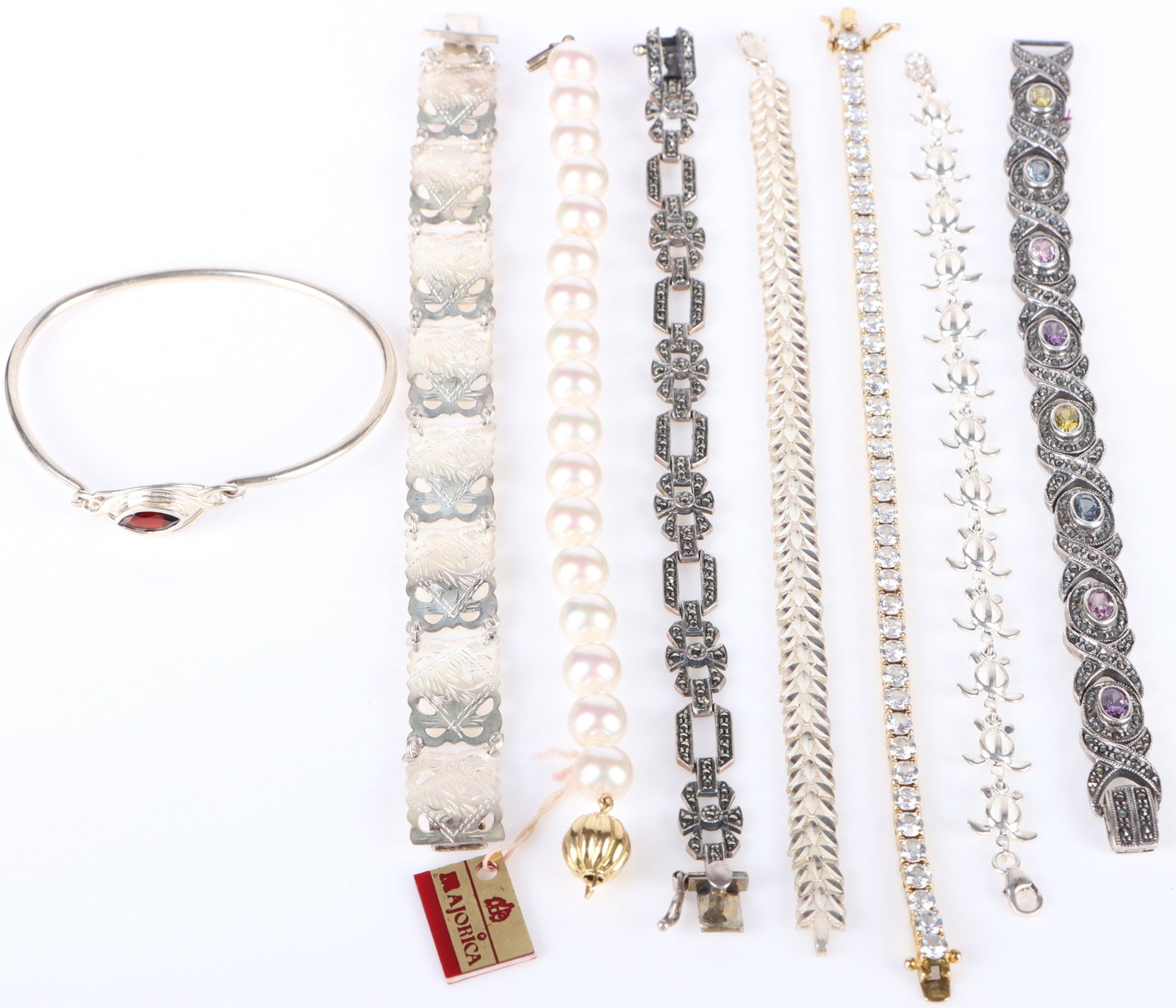 COLLECTIBLE STERLING SILVER LADIES BRACELETS - (8): 179028 COLLECTIBLE STERLING SILVER LADIES BRACELETS - (8) Collectible sterling silver ladies bracelets to include one faux pearl ladies bracelet, four patterned sterling bracelets, one marquise garnet
