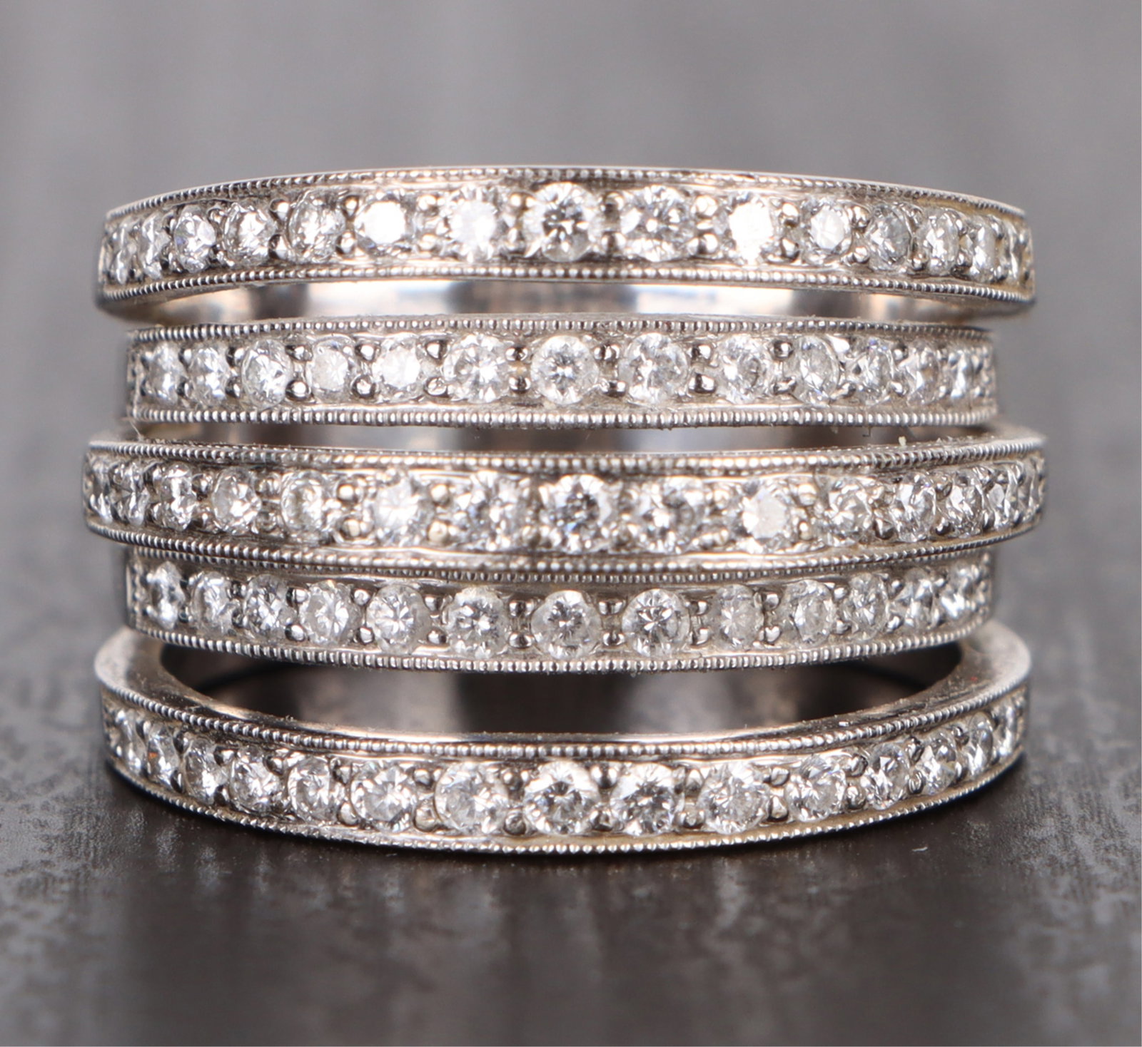 1.42CTW DIAMOND 18K WHITE GOLD LADIES RING: 179137 1.42CTW DIAMOND 18K WHITE GOLD LADIES RING 1.42CTW Diamond 18k white gold ladies ring with seventy-one 0.02ct round diamonds. Stone Type: Diamond Weight: 11.3 Grams Size: US 6.5 Condition:Very 