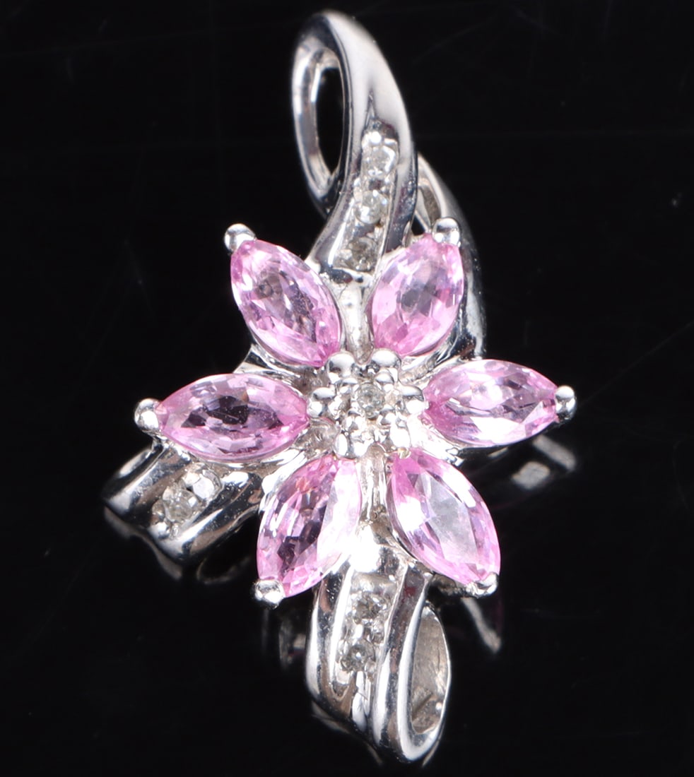 10K WHITE GOLD PINK SAPPHIRE DIAMOND PENDANT: 179304 10K WHITE GOLD PINK SAPPHIRE DIAMOND PENDANT 10k yellow gold pink sapphire diamond floral ladies pendant with six 0.10ct marquise pink sapphires and eight 0.01ct round diamonds. Stone Type: Ass