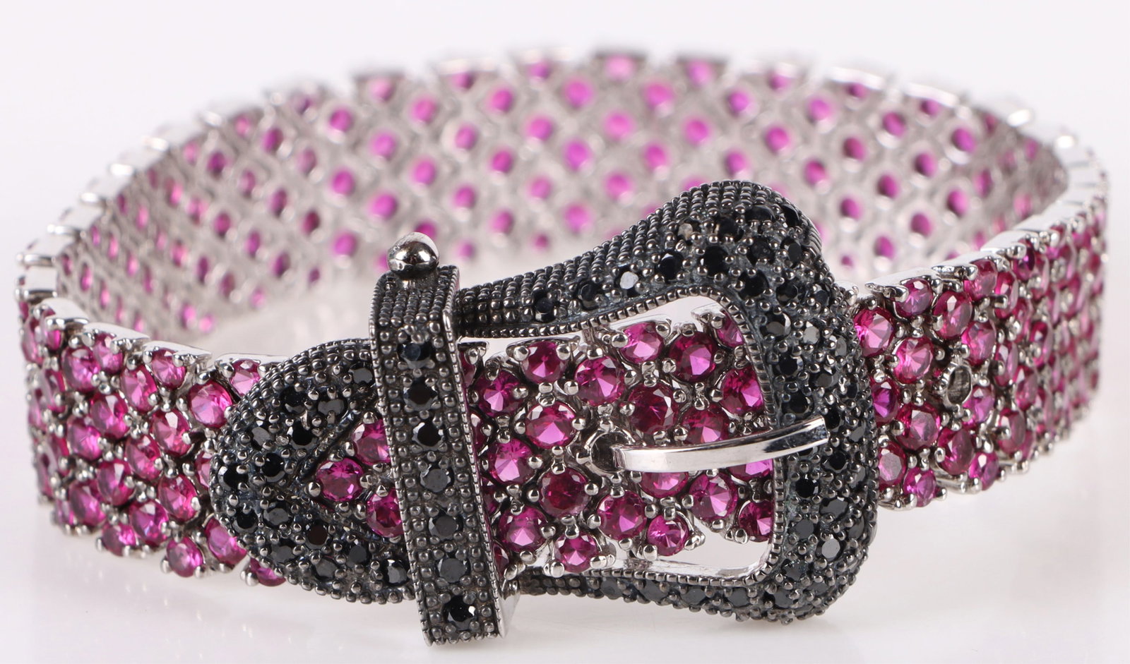 PINK SAPHHIRE LADIES BUCKLE BRACELET ~ 26.0CTW: 181011 PINK SAPHHIRE LADIES BUCKLE BRACELET ~ 26.0CTW Pink sapphire ladies buckle bracelet with approximately 252 round 0.10-0.08ct pink sapphires. Stone Type: Sapphire Weight: 46.7 Grams Size: 7.0"Le