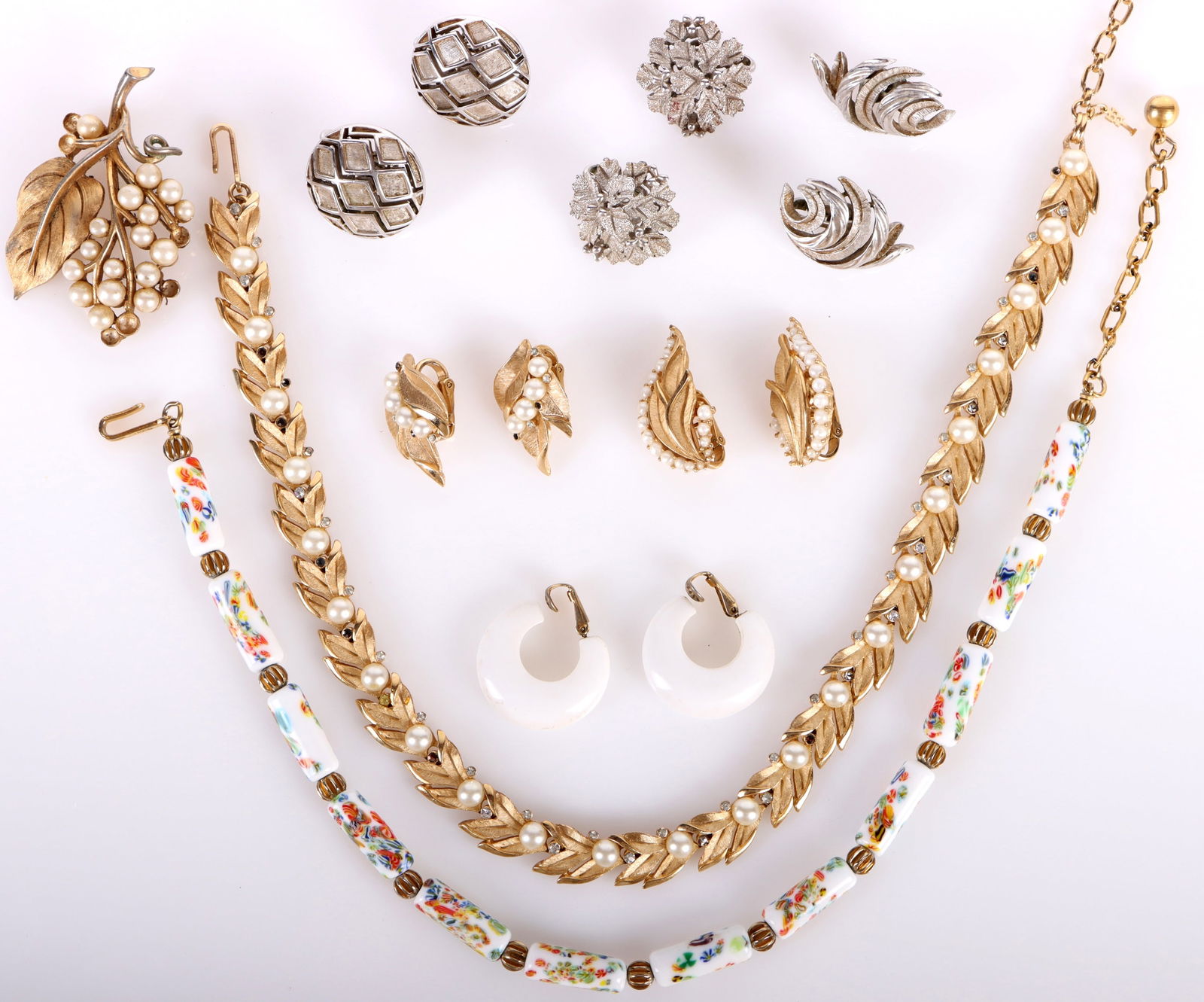 VINTAGE TRIFARI COLLECTIBLE LADIES JEWELRY - (9): 181045 VINTAGE TRIFARI COLLECTIBLE LADIES JEWELRY - (9) Vintage Trifari collectible ladies jewelry to include two necklaces, one faux pearl ladies brooch, and six pairs of varied earrings. Size: 16" l