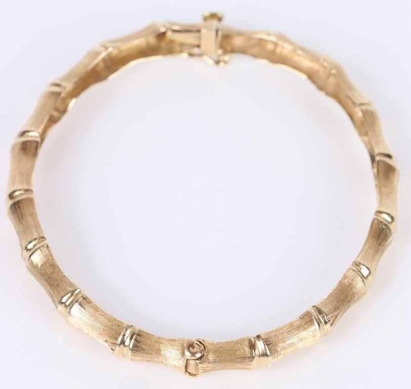 14K YELLOW GOLD LADIES BANGLE BRACELET: 14k gold ladies bangle bracelet featuring a bamboo pattern.Weight: 11 GramsSize: 2.25"Condition: Fine, please refer to photos.