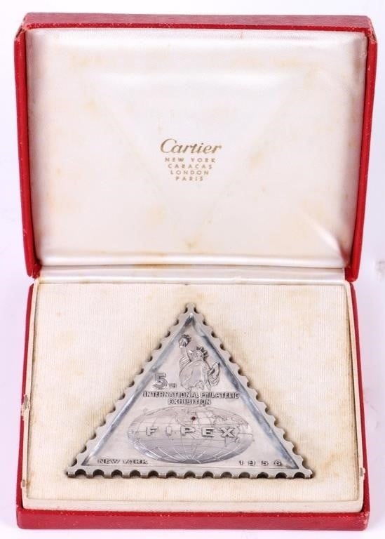CARTIER NEW YORK STERLING SILVER FIPEX MEDAL: 1956 Cartier New York Sterling silver FIPEX medal commemorating the 5th International Philatelic Exhibition. Come with original box. Has engraving on back.Weight: 44.3 GramsSize: 2.5" LengthCondition: