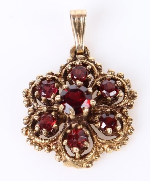 0.85CTW GARNET 14K YELLOW GOLD LADIES PENDANT: 0.85CTW garnet 14k yellow gold ladies pendant with one 0.25ct round garnet and six 0.10ct round garnets.Stone Type: GarnetSize: 1.0" lengthCondition: Very fine.