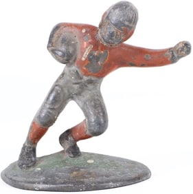 VINTAGE CAST IRON FOOTBALL PLAYER DOORSTOP