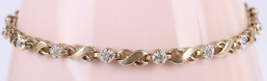 10K YELLOW GOLD DIAMOND LADIES BRACELET: 10k yellow gold diamond ladies bracelet with sixteen 0.01ct round diamonds. Stone Type: Diamond Weight: 7.3 Grams Size: 7.5" length Condition: Very fine.