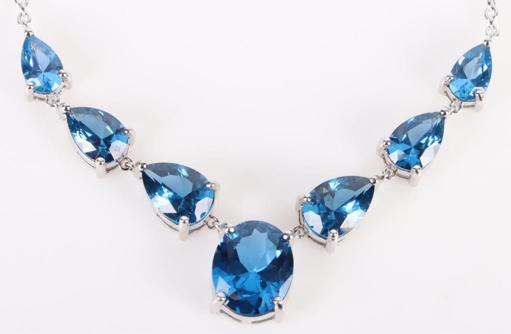 8CTW SPINEL STERLING SILVER LADIES NECKLACE: 8CTW Spinel sterling silver ladies necklace to include 6 1CT teardrop stones and a 2CT center stone Stone Type: Spinel Weight: 11.87 Size: 18"-20" Length Condition: Very Fine